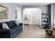 Cozy living room with plush seating, decorative shelving, and an open layout at 1485 Endicot Way, Mount Pleasant, SC 29466