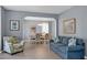 Inviting living room with stylish furniture, showcasing seamless flow to the dining area at 1485 Endicot Way, Mount Pleasant, SC 29466