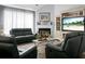 Comfortable living room with a fireplace, modern furniture, and a beach-themed entertainment center at 1485 Endicot Way, Mount Pleasant, SC 29466
