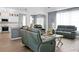 Open-concept living space with modern furniture, seamlessly connecting to the kitchen and dining area at 1485 Endicot Way, Mount Pleasant, SC 29466