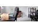 Spacious office area with a large chair, wooden desk, shelves and a printer in the background at 1485 Endicot Way, Mount Pleasant, SC 29466