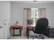 Bright home office with a wooden desk, globe, sewing machine, and a large comfortable chair at 1485 Endicot Way, Mount Pleasant, SC 29466