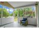 Relaxing screened porch with a view of the serene backyard and outdoor kitchen at 1485 Endicot Way, Mount Pleasant, SC 29466
