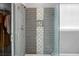 Modern glass shower features gray tile and a built-in niche for storing toiletries at 1485 Endicot Way, Mount Pleasant, SC 29466
