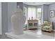 Bright sitting room featuring an accent chair, buffet, and large windows at 1485 Endicot Way, Mount Pleasant, SC 29466