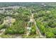 An aerial view shows a home with a long driveway in a wooded area at 1502 Southwick Dr, Johns Island, SC 29455
