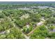 Aerial view of a home and wooded lot are surrounded by trees at 1502 Southwick Dr, Johns Island, SC 29455