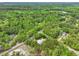 An aerial view features a home set back on a large wooded lot at 1502 Southwick Dr, Johns Island, SC 29455