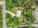 Aerial view of a landscaped property features a swimming pool and circular driveway at 1502 Southwick Dr, Johns Island, SC 29455