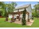 Spacious backyard featuring a pergola, outdoor cooking area, and mature trees at 1502 Southwick Dr, Johns Island, SC 29455