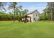 Expansive backyard with a lush green lawn and a charming outdoor patio at 1502 Southwick Dr, Johns Island, SC 29455