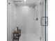 Sleek bathroom with a modern shower, glass door, and a wooden bench at 1502 Southwick Dr, Johns Island, SC 29455