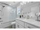 Elegant bathroom with a tiled shower, modern vanity, and a large mirror at 1502 Southwick Dr, Johns Island, SC 29455