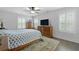 Bedroom featuring hardwood floors, ceiling fan, and a dresser at 1502 Southwick Dr, Johns Island, SC 29455