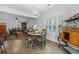 Bright breakfast nook with hardwood floors, a modern chandelier, and views of the backyard at 1502 Southwick Dr, Johns Island, SC 29455
