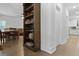 Hallway featuring a large bookcase with views to living room and eat in area at 1502 Southwick Dr, Johns Island, SC 29455
