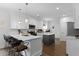 Modern kitchen with white cabinets, a gray island, hardwood floors, and a breakfast bar with seating at 1502 Southwick Dr, Johns Island, SC 29455
