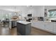 Bright kitchen featuring white cabinets, stainless steel appliances, a gray island, and hardwood floors at 1502 Southwick Dr, Johns Island, SC 29455