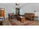 Inviting living room featuring hardwood floors, a comfortable leather sofa, and a stylish area rug at 1502 Southwick Dr, Johns Island, SC 29455
