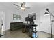 Office featuring hardwood floors, modern ceiling fan, large computer, and comfortable couch at 1502 Southwick Dr, Johns Island, SC 29455