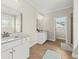 Bright bathroom with double vanities, granite counters, and a walk-in shower at 1505 Fort Palmetto Cir, Mount Pleasant, SC 29466