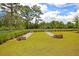 Well-kept community area with lush grass, manicured landscaping, and decorative walls at 1505 Fort Palmetto Cir, Mount Pleasant, SC 29466