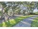 Charming community grounds with mature trees and a gravel pathway at 1505 Fort Palmetto Cir, Mount Pleasant, SC 29466