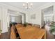 Open-concept dining area with hardwood floors, adjacent to the kitchen and living room at 1505 Fort Palmetto Cir, Mount Pleasant, SC 29466