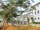 Elegant white building exterior featuring a columned walkway and mature trees at 1505 Fort Palmetto Cir, Mount Pleasant, SC 29466