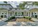 Beautiful building featuring a stone exterior and lovely rocking chairs at 1505 Fort Palmetto Cir, Mount Pleasant, SC 29466
