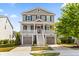 Charming two-story home with a front porch, garage, and well-maintained landscaping at 1505 Fort Palmetto Cir, Mount Pleasant, SC 29466