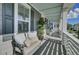 Inviting front porch featuring a seating bench with decorative pillows at 1505 Fort Palmetto Cir, Mount Pleasant, SC 29466