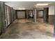 Spacious garage featuring concrete block construction, multiple garage doors, and ample room for vehicles at 1505 Fort Palmetto Cir, Mount Pleasant, SC 29466