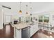 Bright, open kitchen and dining area, flowing into the living room with fireplace at 1505 Fort Palmetto Cir, Mount Pleasant, SC 29466