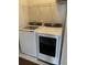 This laundry room features modern Samsung washer and dryer units, and a convenient wire shelf at 1505 Fort Palmetto Cir, Mount Pleasant, SC 29466