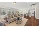 Open-concept living room and kitchen with hardwood floors and neutral décor at 1505 Fort Palmetto Cir, Mount Pleasant, SC 29466