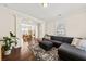 Comfortable living room with a sectional sofa, area rug, and connection to the dining room at 1505 Fort Palmetto Cir, Mount Pleasant, SC 29466