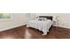 Cozy main bedroom with hardwood floors and a comfortable king bed at 1505 Fort Palmetto Cir, Mount Pleasant, SC 29466