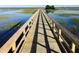 A long wooden walkway extends across a marsh, offering views of the surrounding landscape at 1505 Fort Palmetto Cir, Mount Pleasant, SC 29466