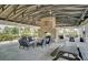 Outdoor brick pavilion with comfortable seating, picnic tables, and fireplace feature perfect for relaxing and entertaining at 1505 Fort Palmetto Cir, Mount Pleasant, SC 29466