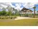 Inviting picnic pavilion with tables, surrounded by greenery and well-manicured lawns at 1505 Fort Palmetto Cir, Mount Pleasant, SC 29466