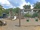 Community playground featuring a slide, swings, and climbing structures for outdoor fun at 1505 Fort Palmetto Cir, Mount Pleasant, SC 29466