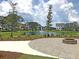 Picturesque pond view with a fountain, surrounded by lush landscaping and charming homes at 1505 Fort Palmetto Cir, Mount Pleasant, SC 29466
