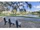 Relaxing community pond with fountain, walking path, and bench seating at 1505 Fort Palmetto Cir, Mount Pleasant, SC 29466