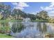 Picturesque pond with a fountain, lush greenery, and clear blue sky at 1505 Fort Palmetto Cir, Mount Pleasant, SC 29466