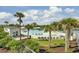 Resort-style pool area with palm trees, sun loungers, and shady cabanas at 1505 Fort Palmetto Cir, Mount Pleasant, SC 29466
