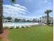 Gorgeous pool with lounge chairs and manicured lawn under a sunny sky at 1505 Fort Palmetto Cir, Mount Pleasant, SC 29466