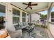 Relax on this cozy outdoor porch featuring comfortable seating and views of the surrounding community at 1505 Fort Palmetto Cir, Mount Pleasant, SC 29466