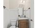 Stylish powder room with decorative mirror, vanity, and modern fixtures at 1505 Fort Palmetto Cir, Mount Pleasant, SC 29466