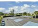 Well maintained blue and gray tennis courts provide recreational opportunities in a beautifully landscaped setting at 1505 Fort Palmetto Cir, Mount Pleasant, SC 29466